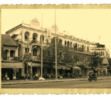 Historic sepia-toned building with classic architecture. A glimpse into the past, vintage urban scene.